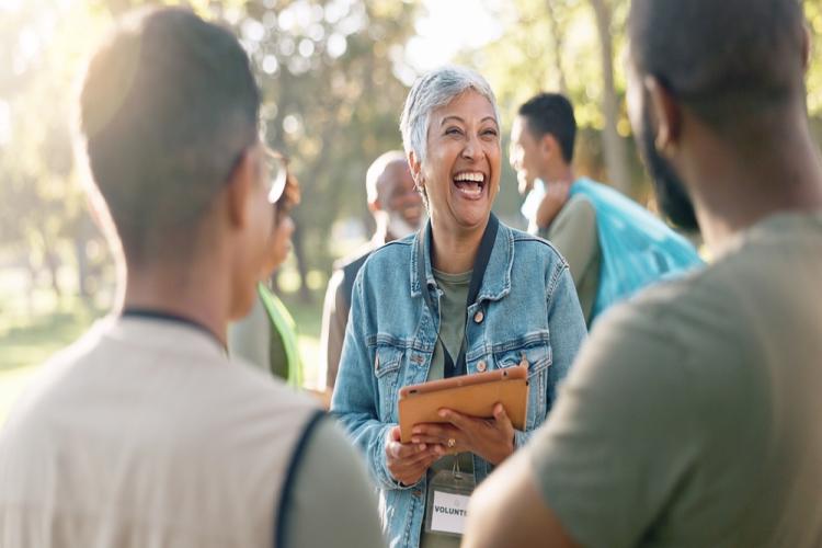 Smiling community access vounteer in a park